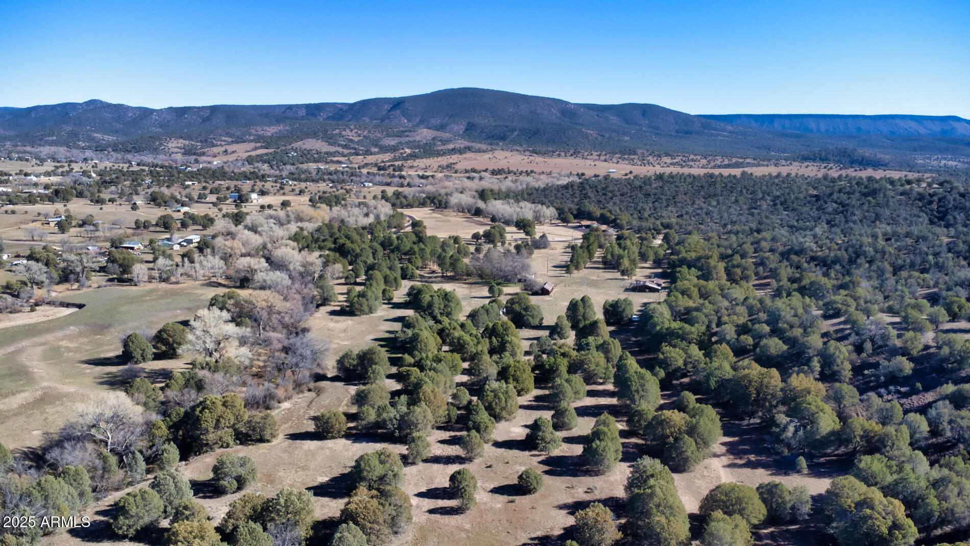 360 Barracks Road, Unit A Young, AZ 85554 - Photo 7 of 17 an aerial view of residential house and sandy dunes