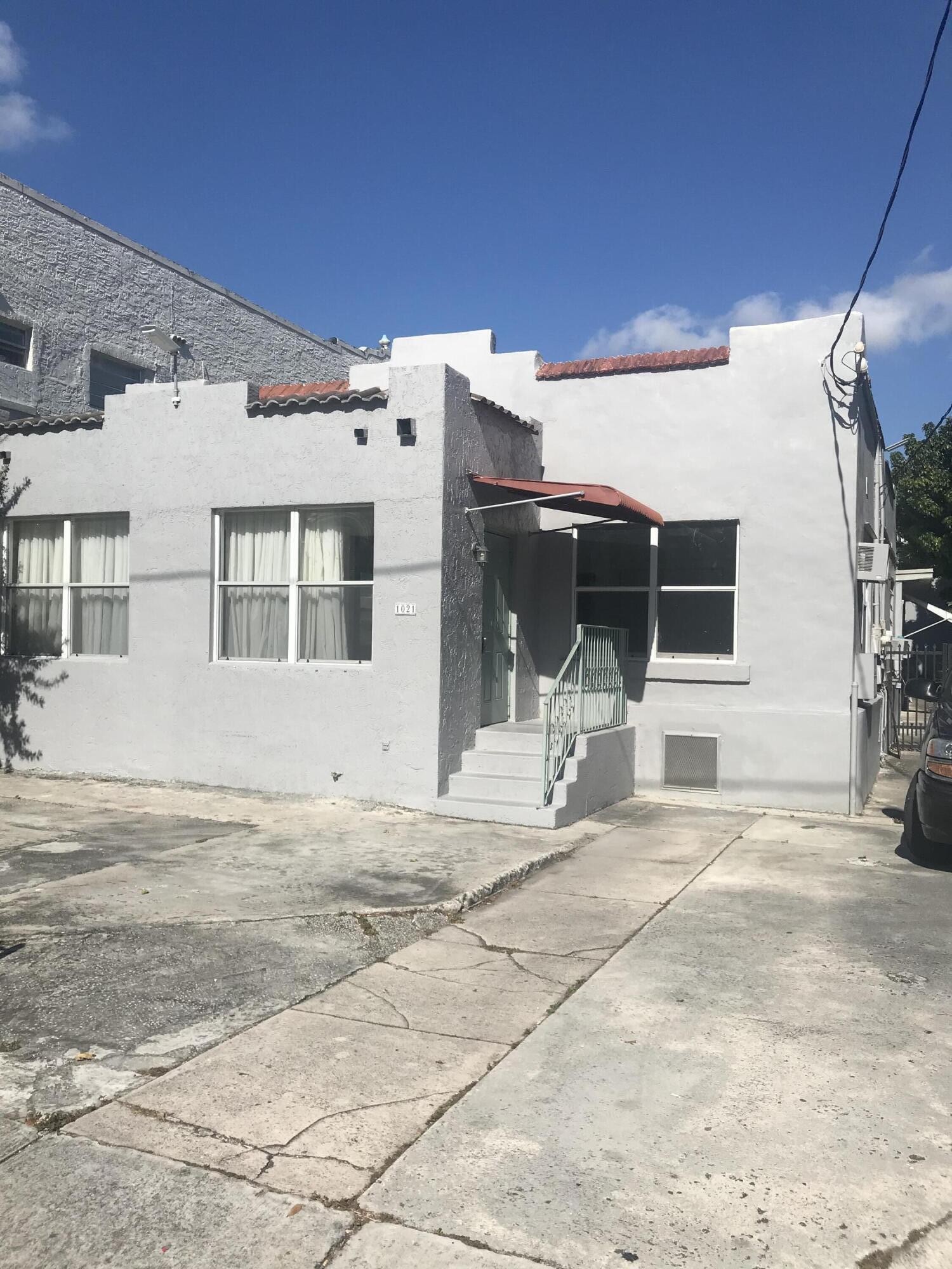 1021 Southwest 5th Street, Unit 2 Miami, FL 33130 - Photo 1 of 7 a view of a house with backyard and sitting area