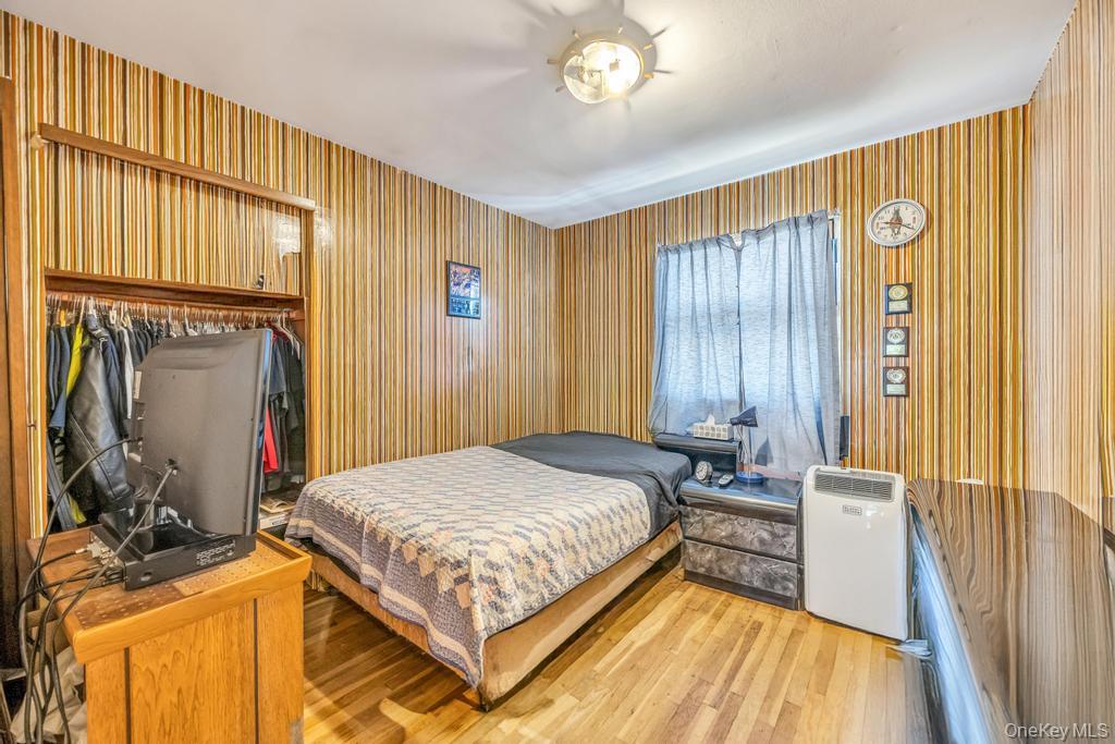 196 Haypath Road Old Bethpage, NY 11804 - Photo 12 of 21 Bedroom with wood finished floors and a closet