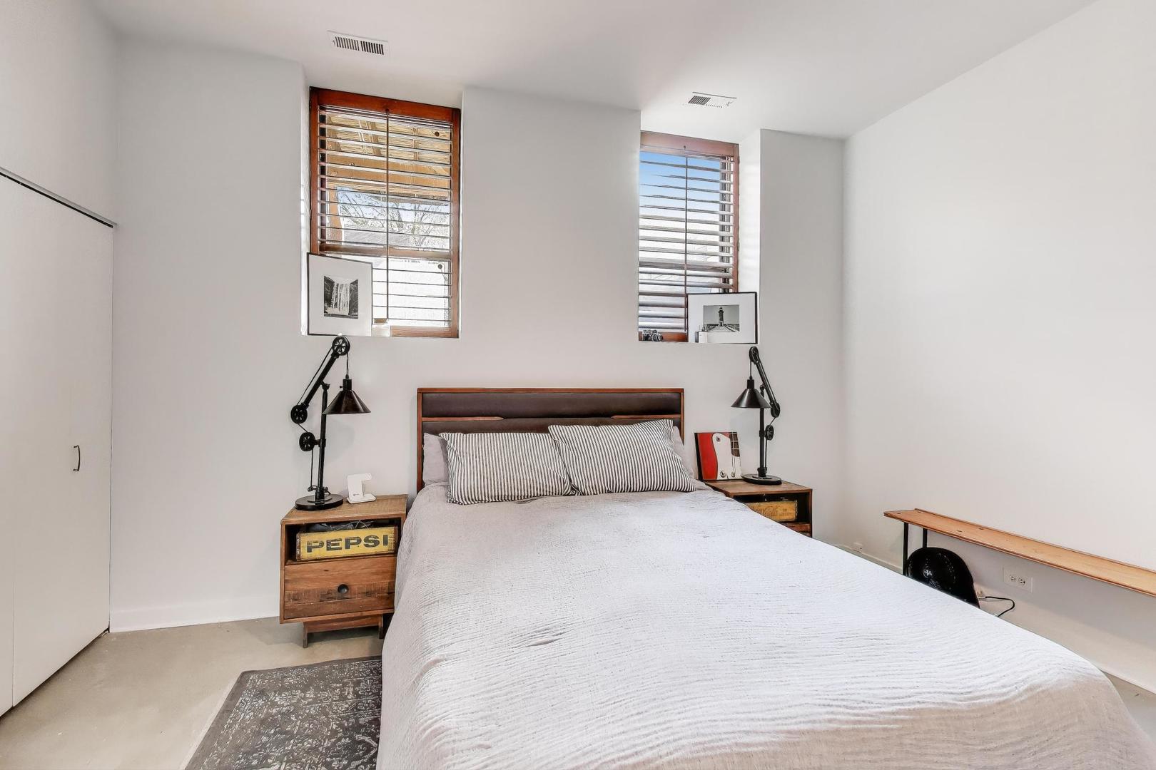 1323 West Belden Avenue, Unit E1 Chicago, IL 60614 - Photo 11 of 23 a bedroom with a bed and a window