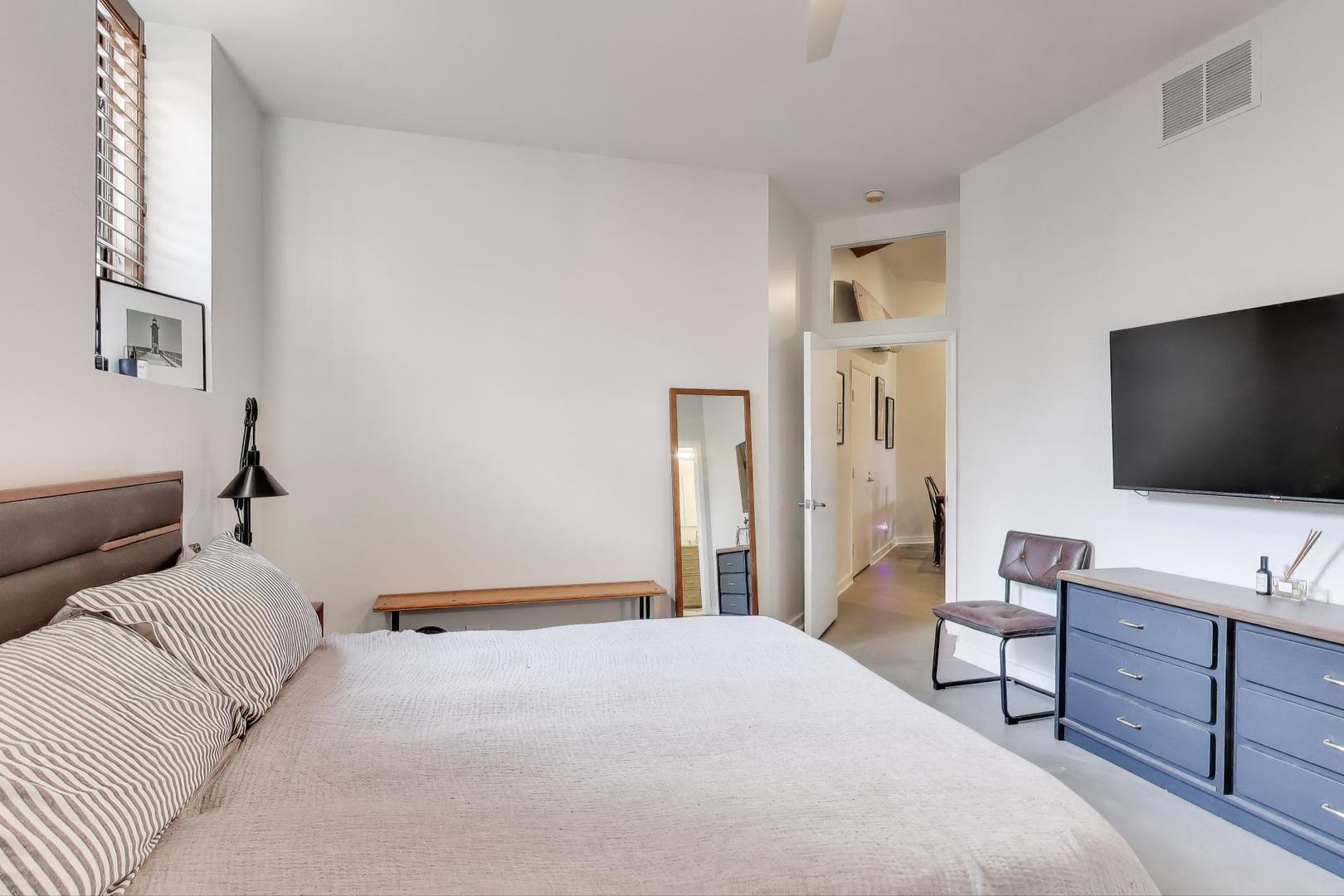 1323 West Belden Avenue, Unit E1 Chicago, IL 60614 - Photo 13 of 23 a bedroom with a bed and a flat screen tv