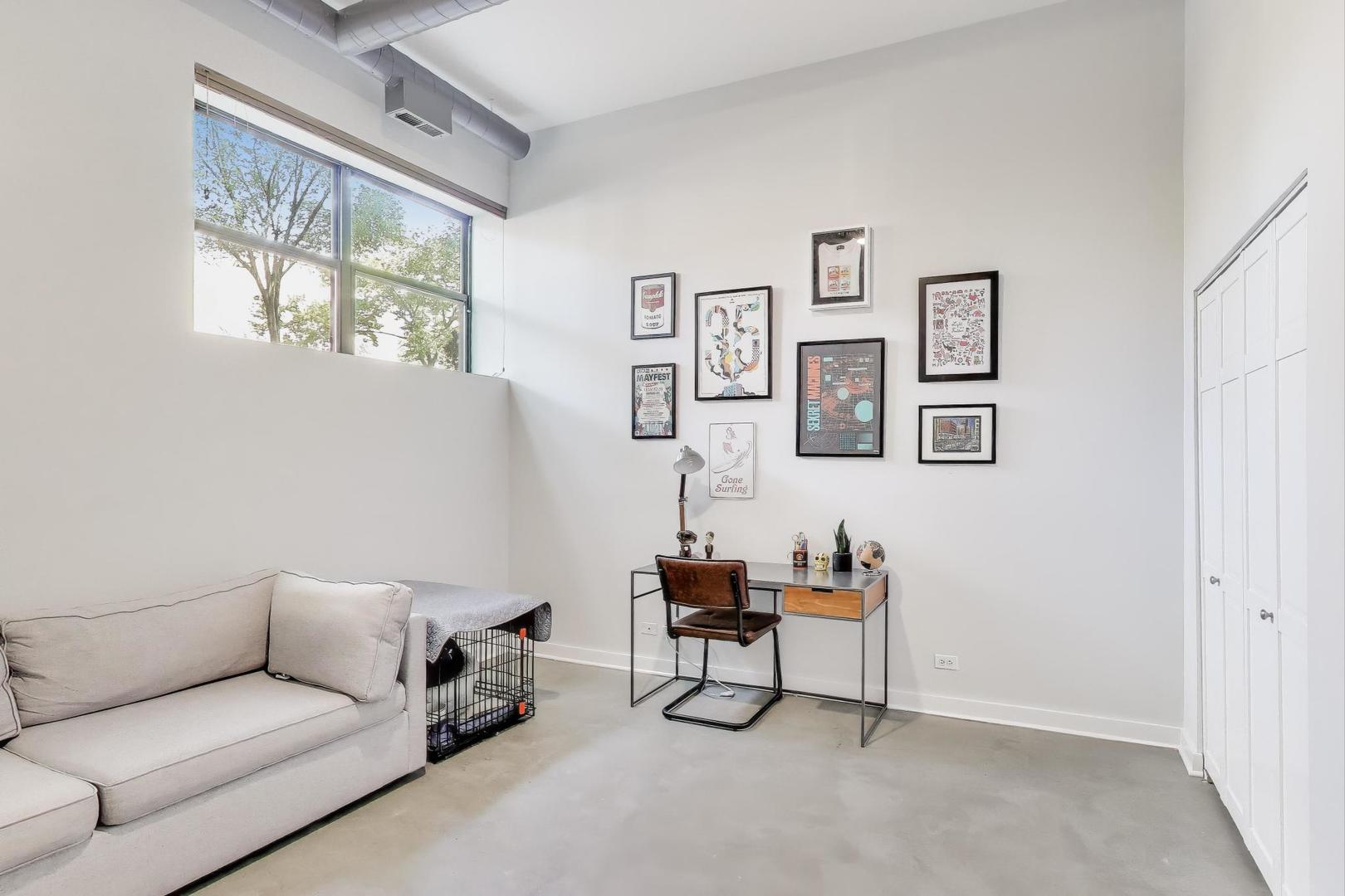 1323 West Belden Avenue, Unit E1 Chicago, IL 60614 - Photo 15 of 23 a living room with furniture and a window