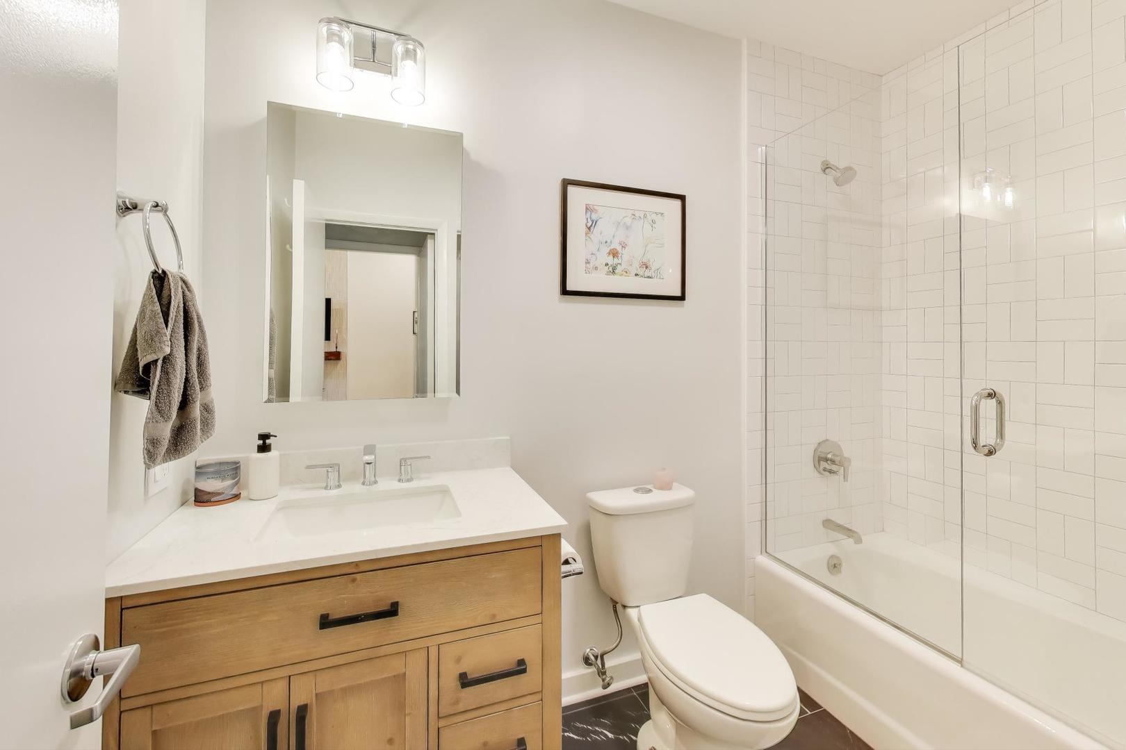 1323 West Belden Avenue, Unit E1 Chicago, IL 60614 - Photo 16 of 23 a bathroom with a sink a toilet and shower