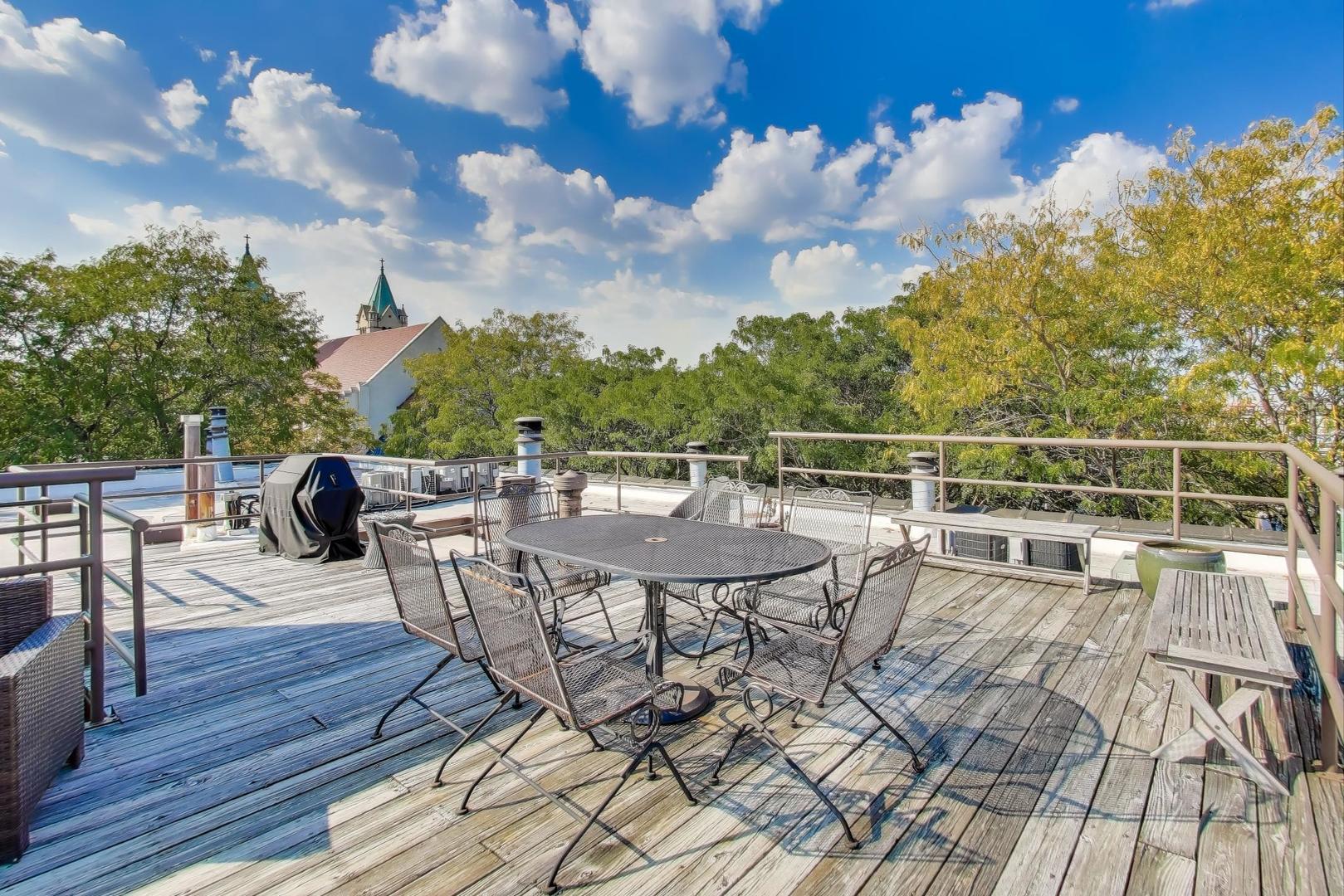 1323 West Belden Avenue, Unit E1 Chicago, IL 60614 - Photo 18 of 23 a view of a chairs and table on the wooden floor