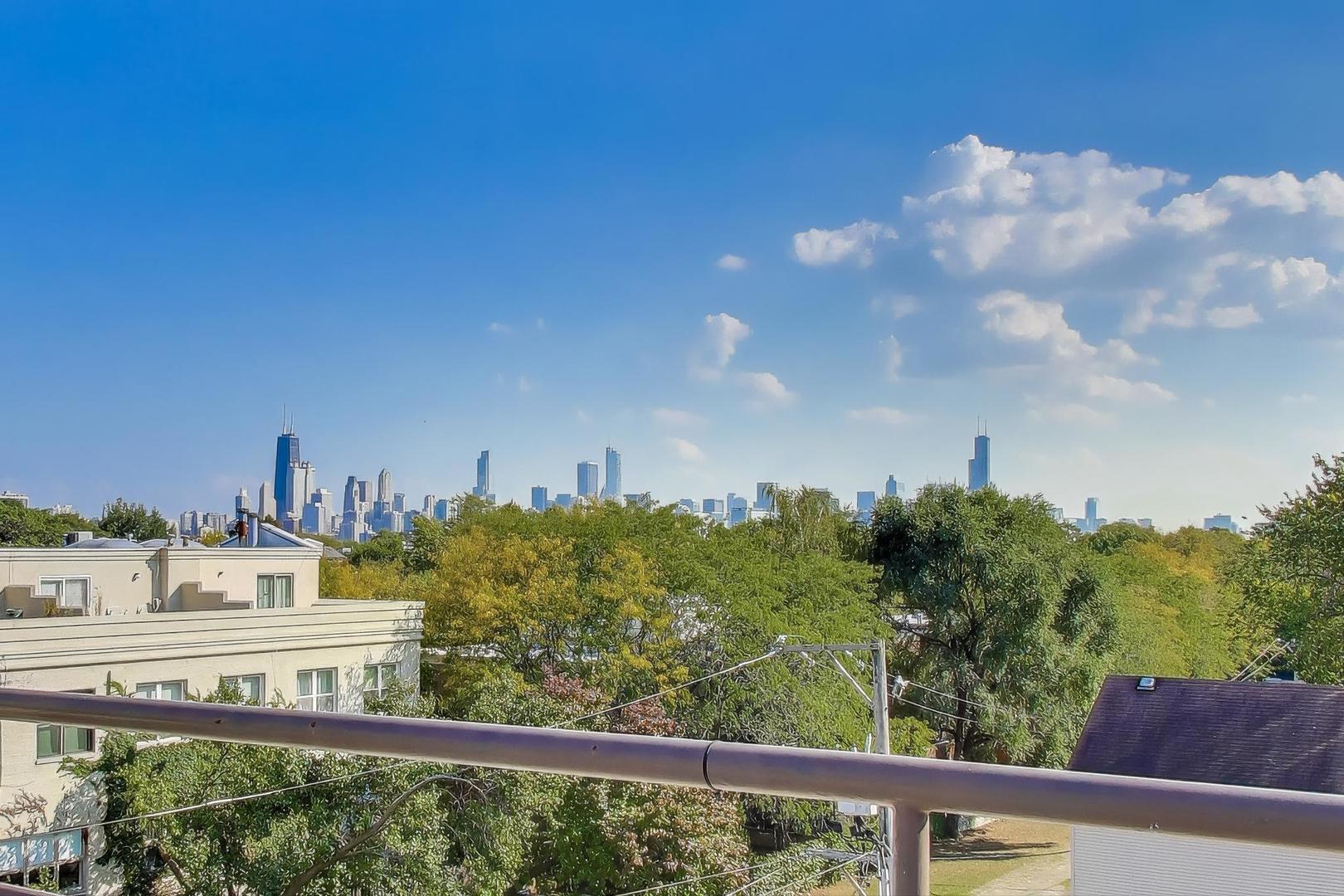 1323 West Belden Avenue, Unit E1 Chicago, IL 60614 - Photo 19 of 23 a view of a large building with a street