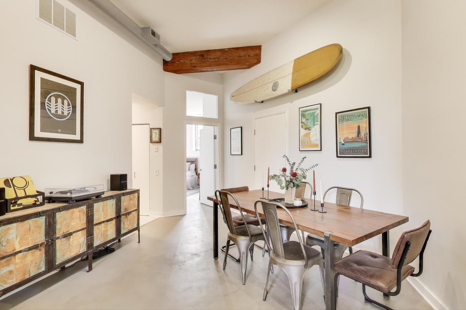 1323 West Belden Avenue, Unit E1 Chicago, IL 60614 - Photo 5 of 23 a dining room with furniture and a window