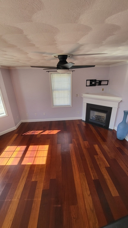 129 Manchester Street, Unit B Lowell, MA 01852 - Photo 13 of 26 a view of empty room with wooden floor
