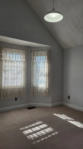 an empty room with a empty space and window