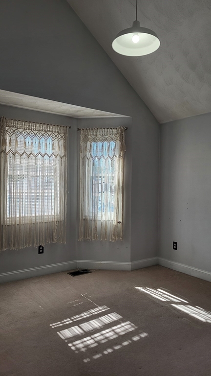 129 Manchester Street, Unit B Lowell, MA 01852 - Photo 17 of 26 an empty room with a empty space and window