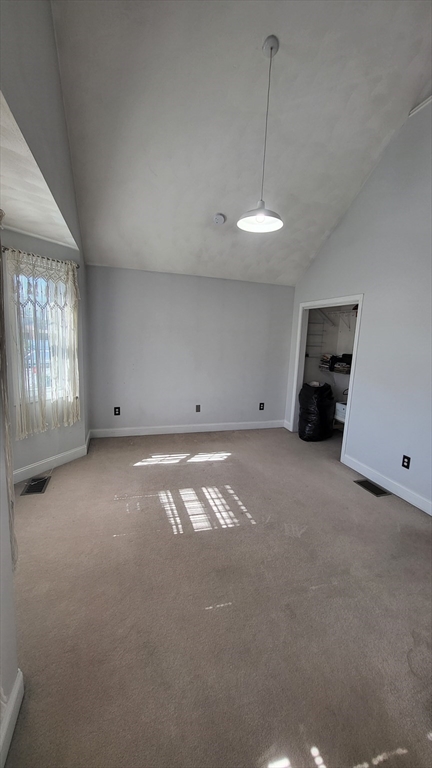 129 Manchester Street, Unit B Lowell, MA 01852 - Photo 19 of 26 an empty room with windows and closet