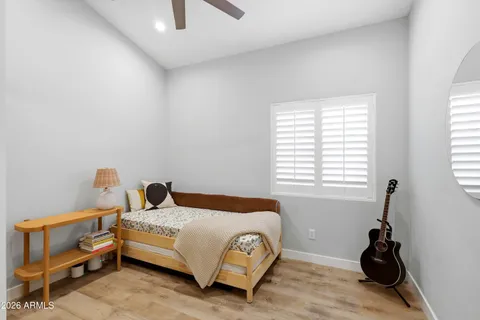 a bedroom with a bed and a window