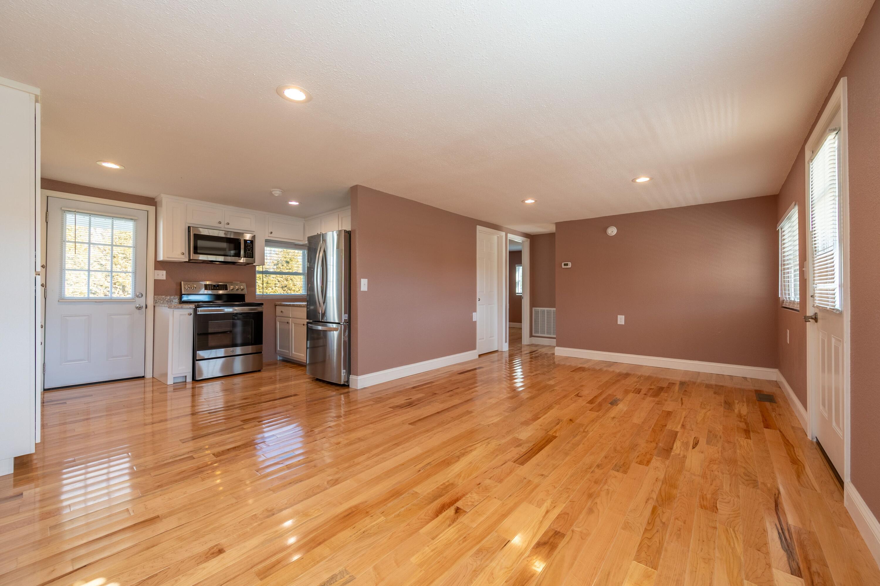 225 Mill Run Road Southwest Floyd, VA 24091 - Photo 13 of 46 a view of a big room with wooden floor and a kitchen