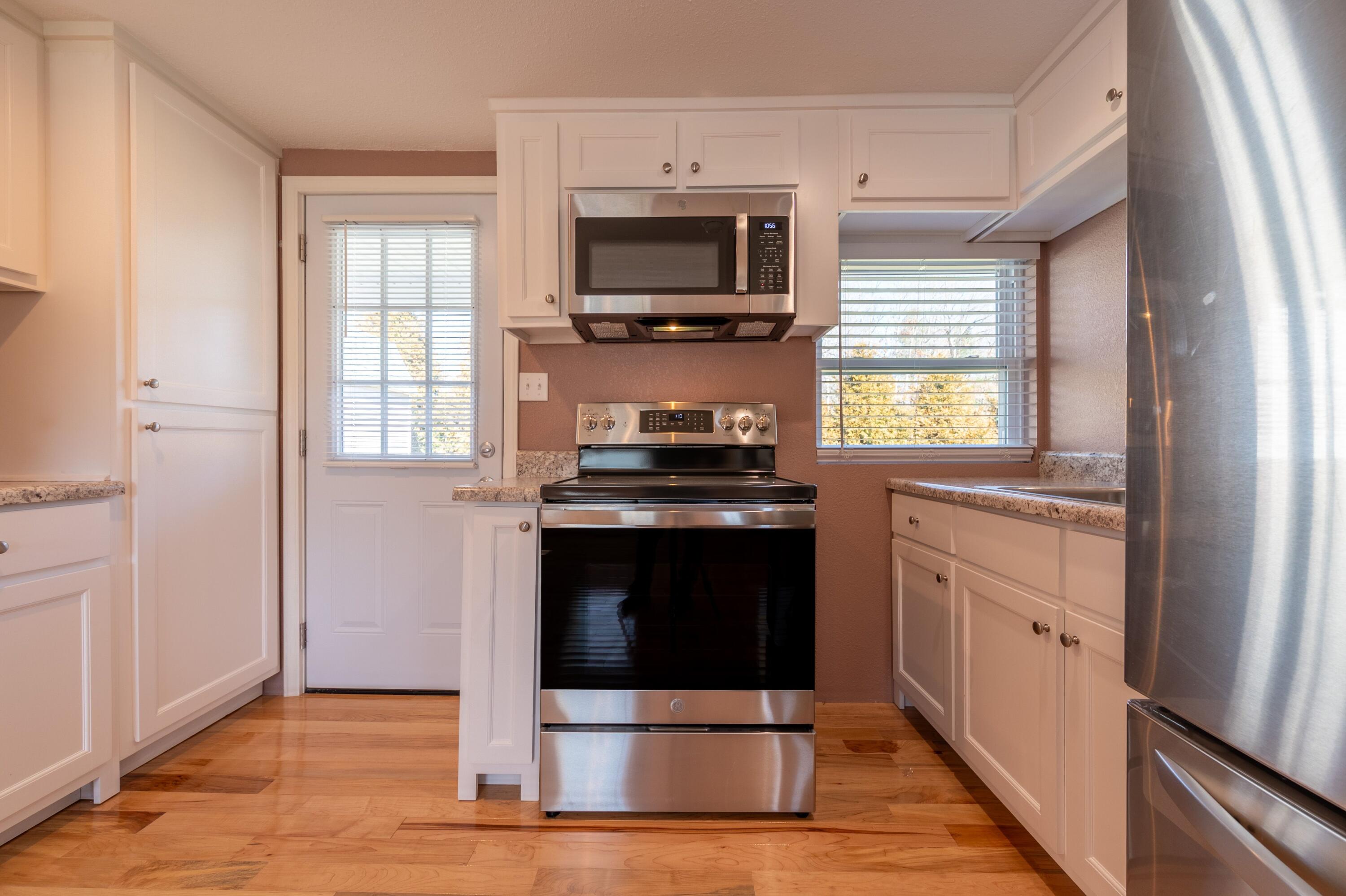 225 Mill Run Road Southwest Floyd, VA 24091 - Photo 17 of 46 a kitchen with cabinets and appliances