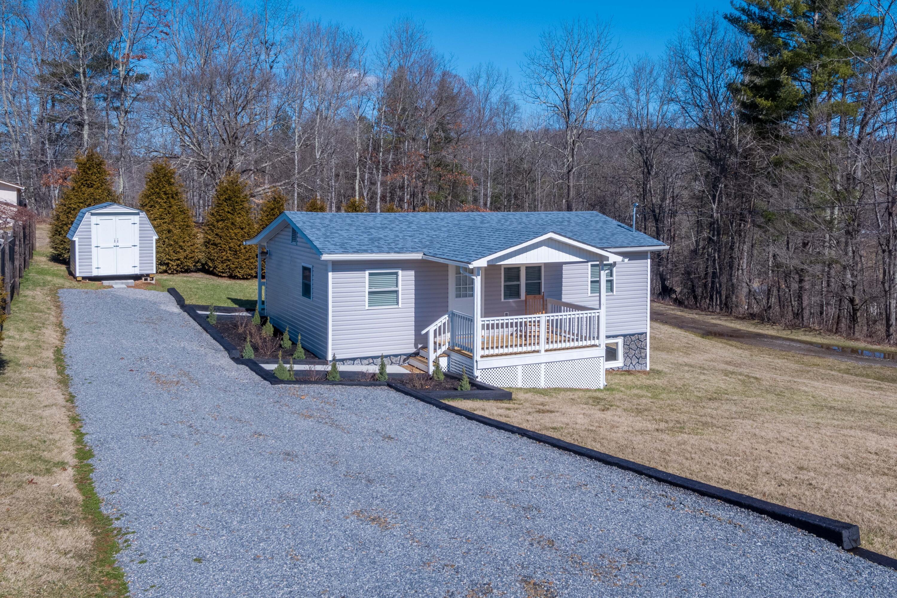 225 Mill Run Road Southwest Floyd, VA 24091 - Photo 2 of 46 a house with trees in the background