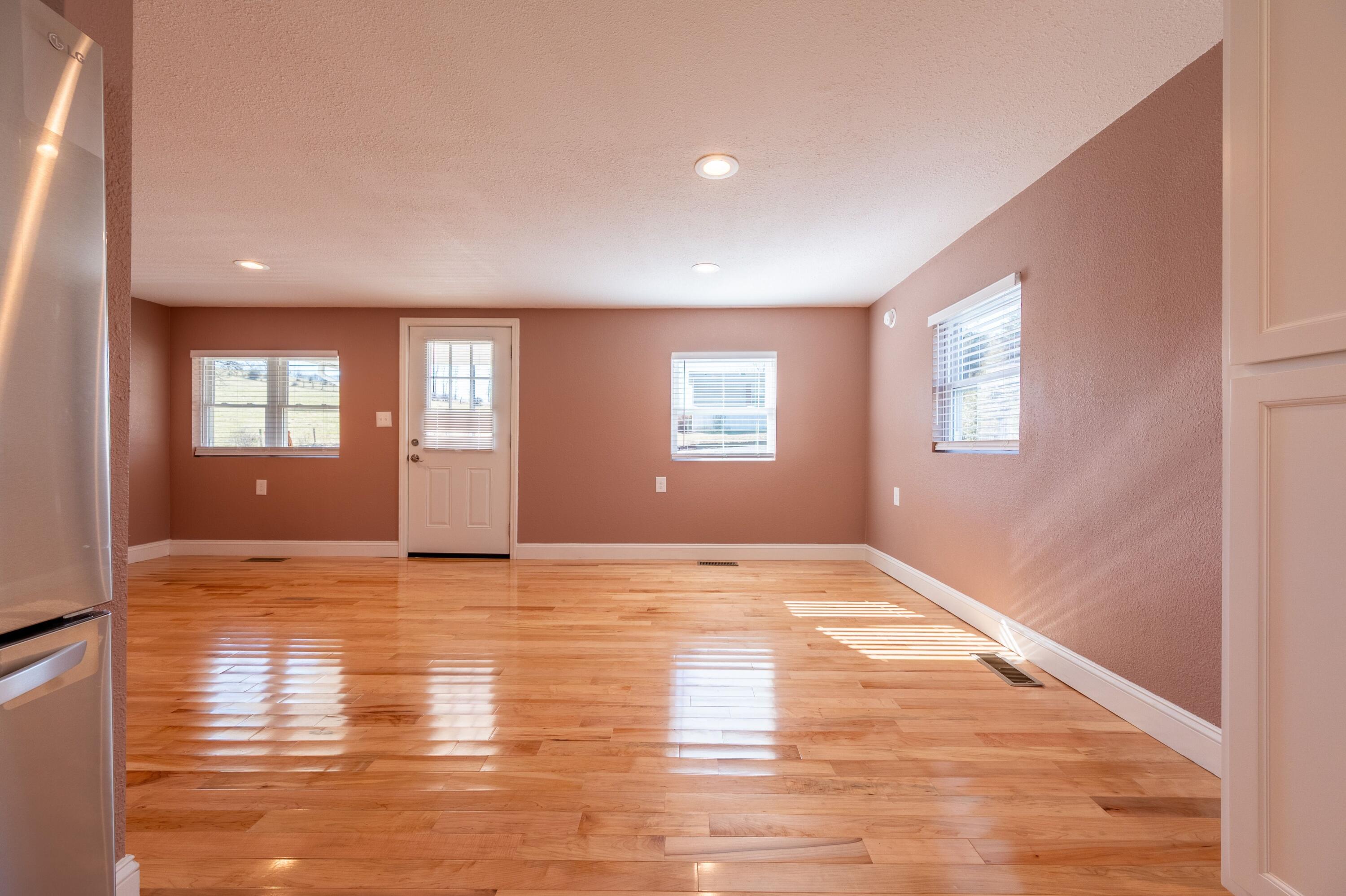225 Mill Run Road Southwest Floyd, VA 24091 - Photo 21 of 46 a view of an empty room with window and wooden floor