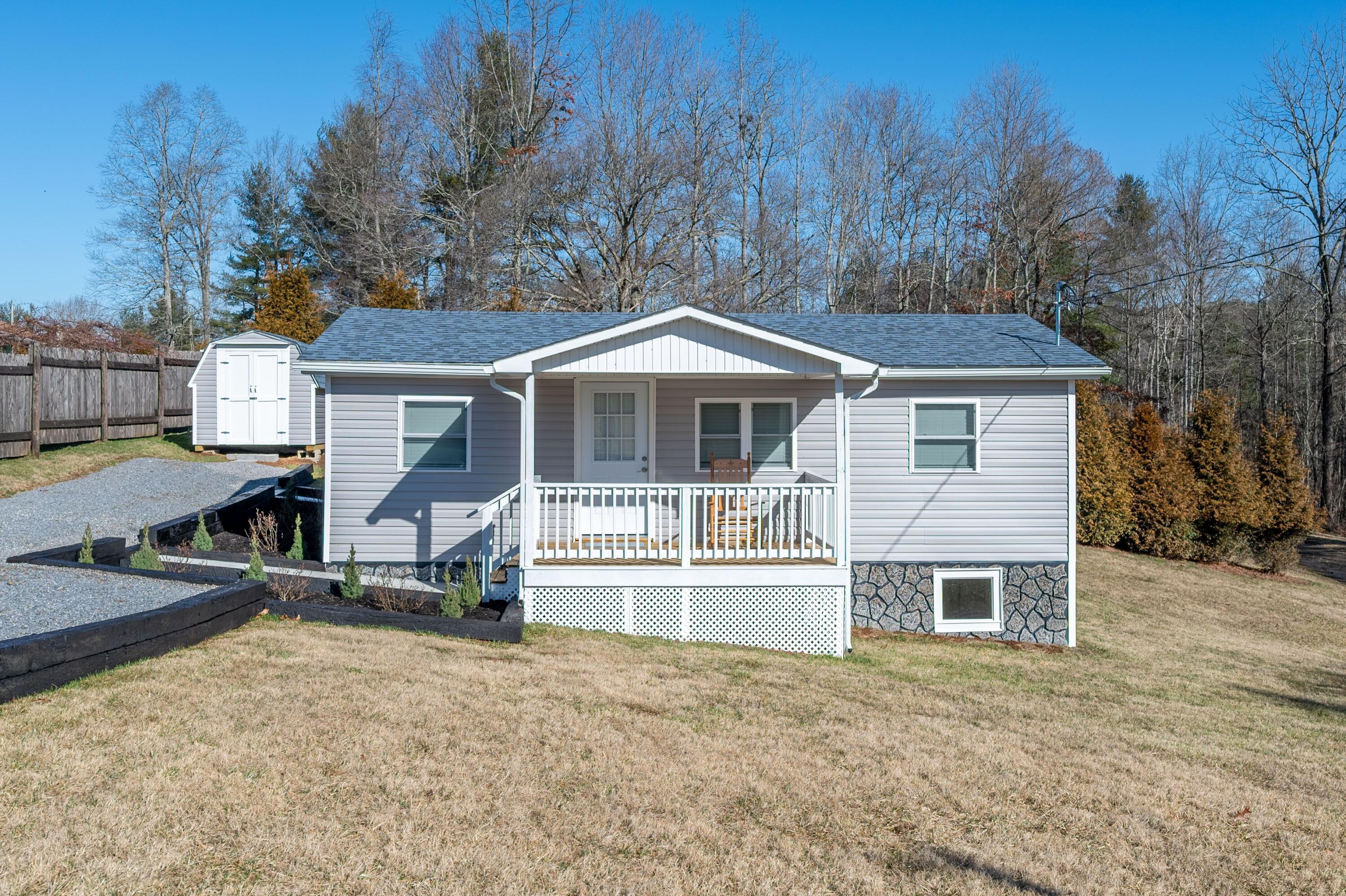 225 Mill Run Road Southwest Floyd, VA 24091 - Photo 3 of 46 front view of a house with a patio