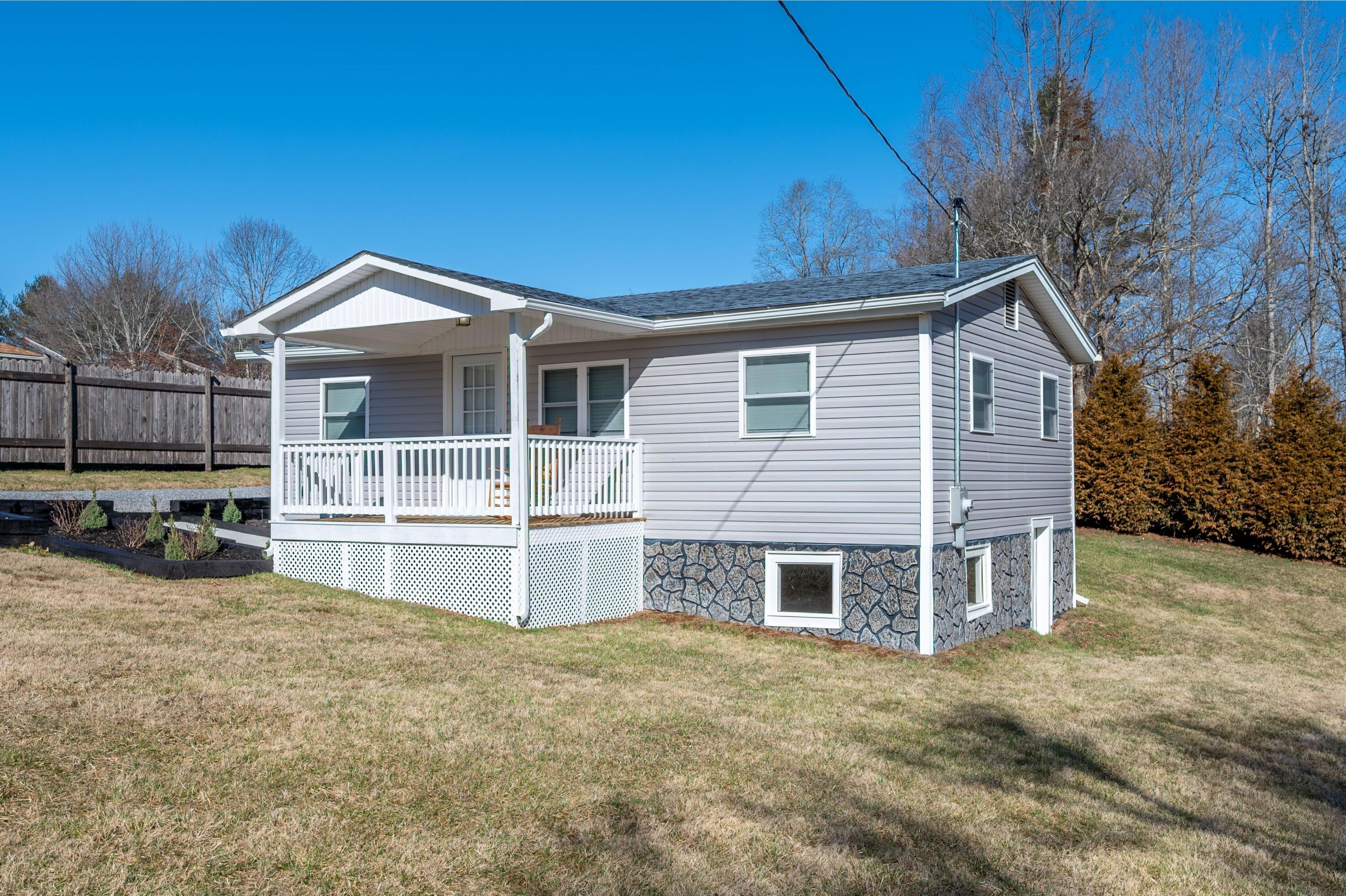 225 Mill Run Road Southwest Floyd, VA 24091 - Photo 4 of 46 a front view of a house with a yard and garage