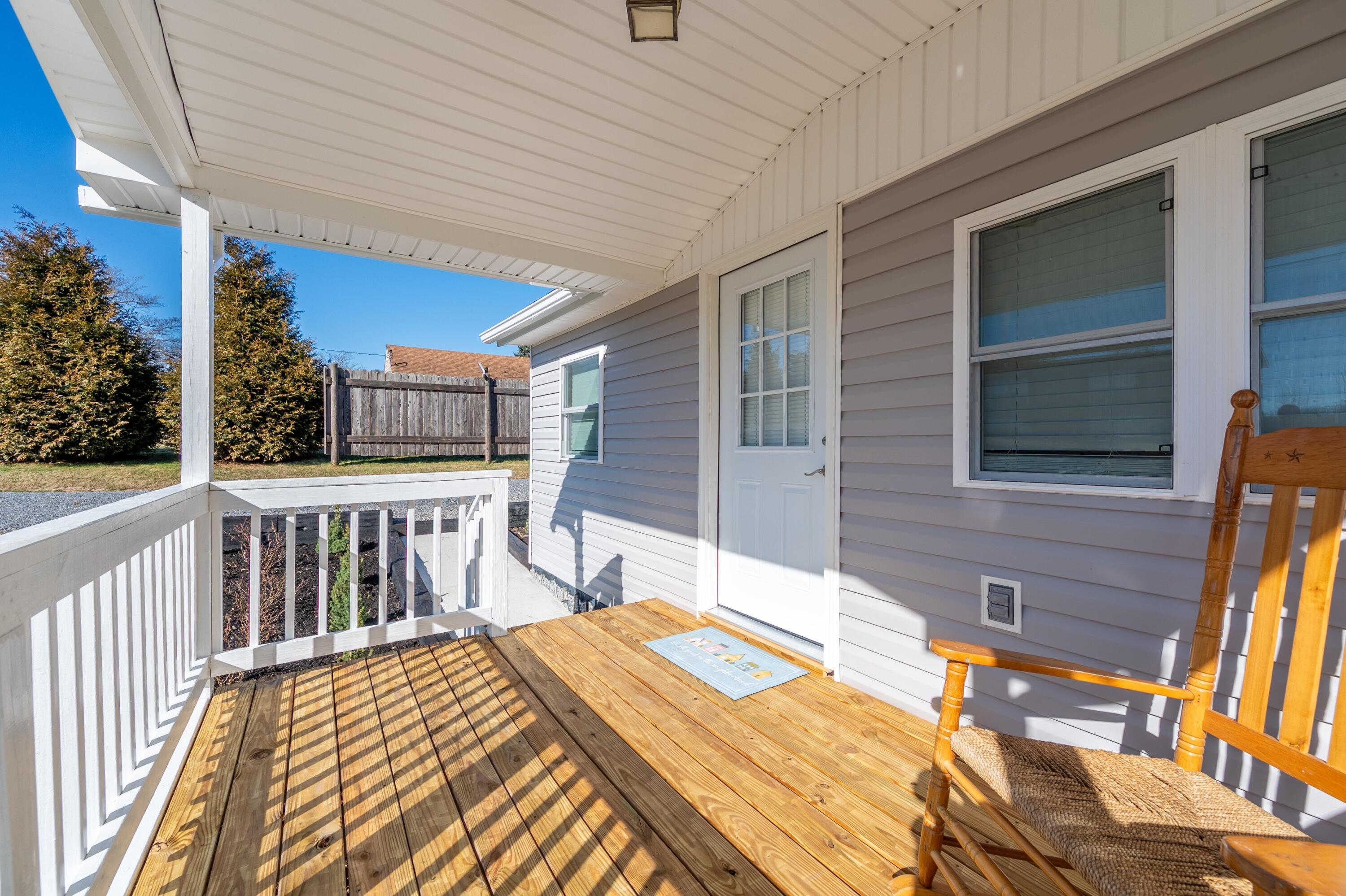 225 Mill Run Road Southwest Floyd, VA 24091 - Photo 6 of 46 a bedroom with a bed and wooden floor