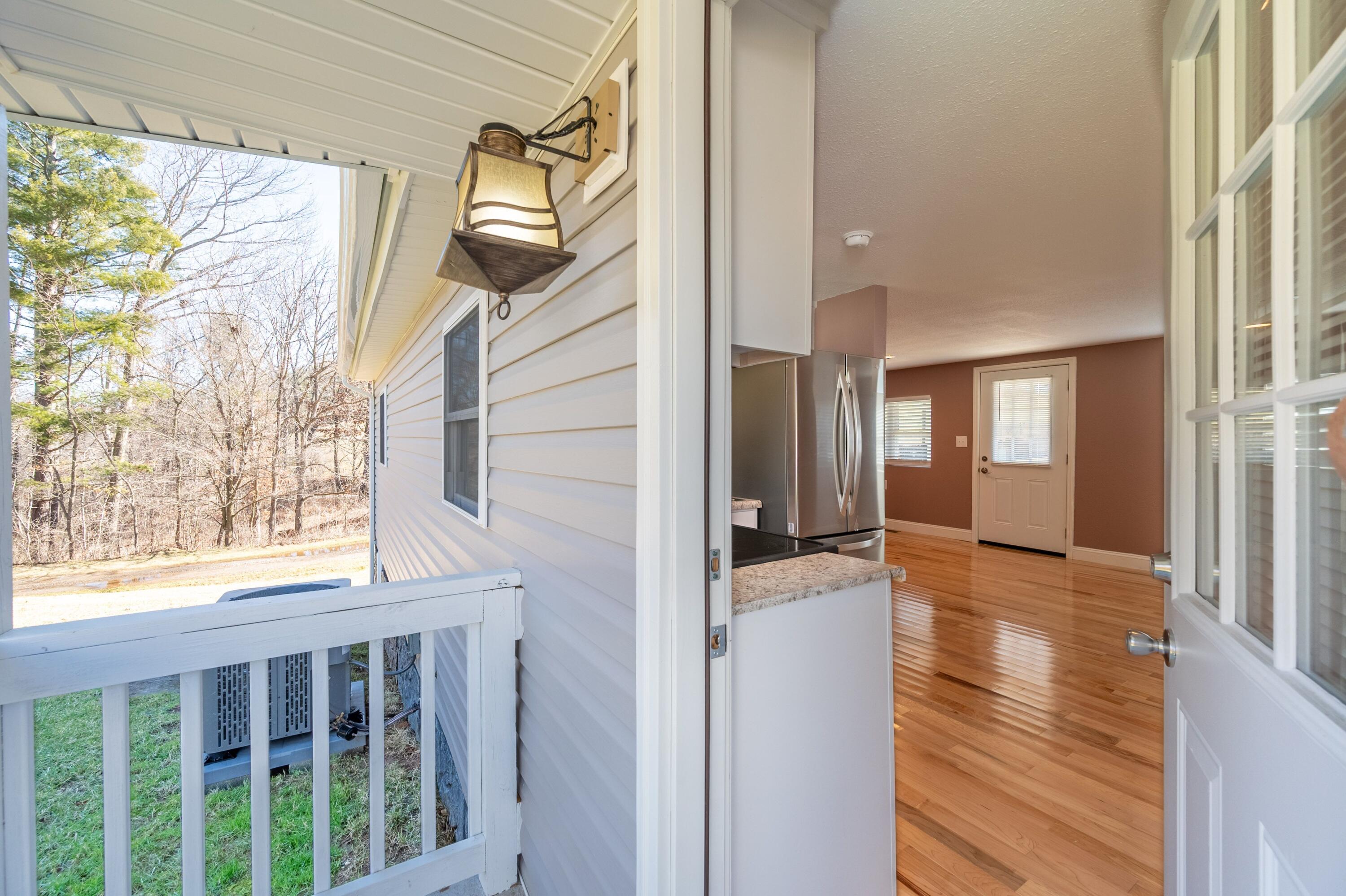 225 Mill Run Road Southwest Floyd, VA 24091 - Photo 7 of 46 a view of hallway with wooden floor and windows