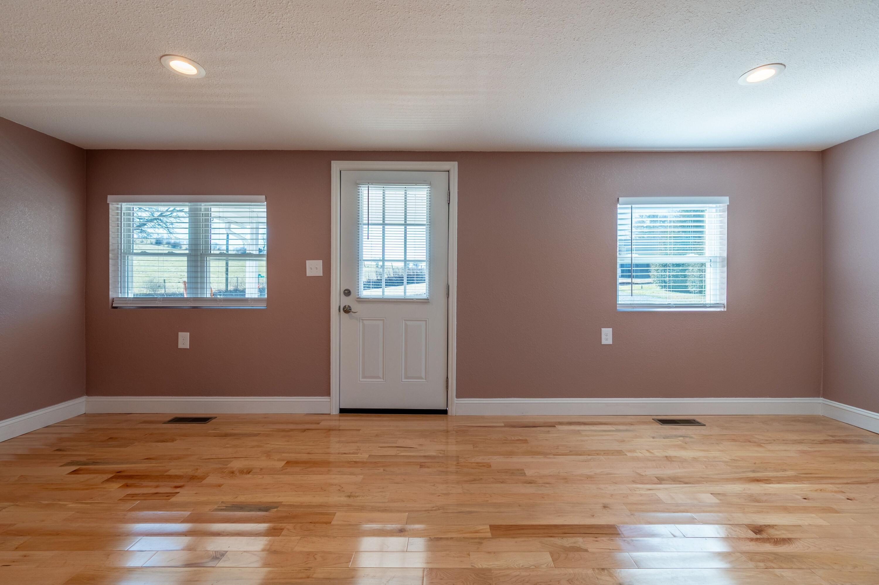 225 Mill Run Road Southwest Floyd, VA 24091 - Photo 9 of 46 a view of an empty room with wooden floor and a window