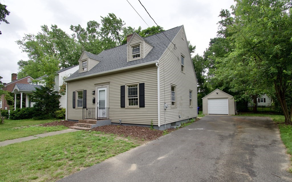 153 Gillette Avenue Springfield, MA 01118 - Photo 1 of 32 a front view of a house with a garden