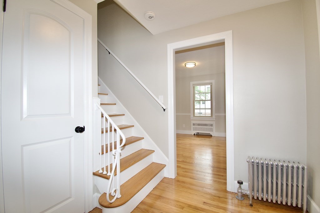 153 Gillette Avenue Springfield, MA 01118 - Photo 13 of 32 a view of entryway and hall with wooden floor