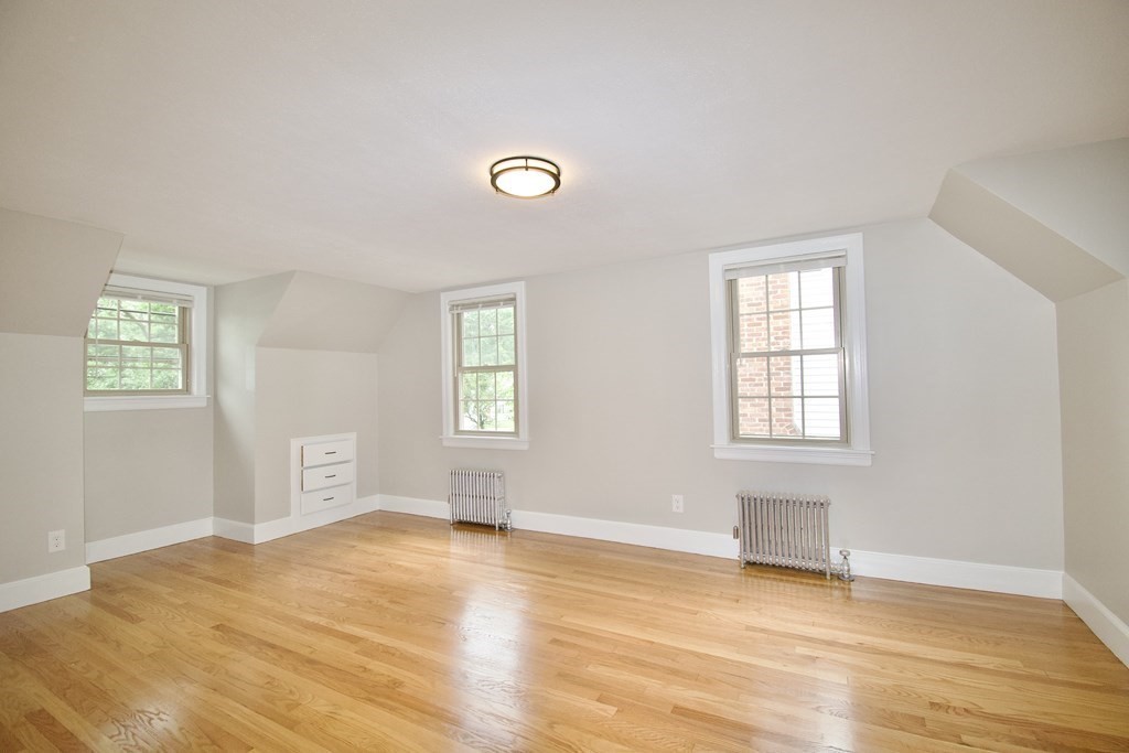 153 Gillette Avenue Springfield, MA 01118 - Photo 18 of 32 an empty room with windows