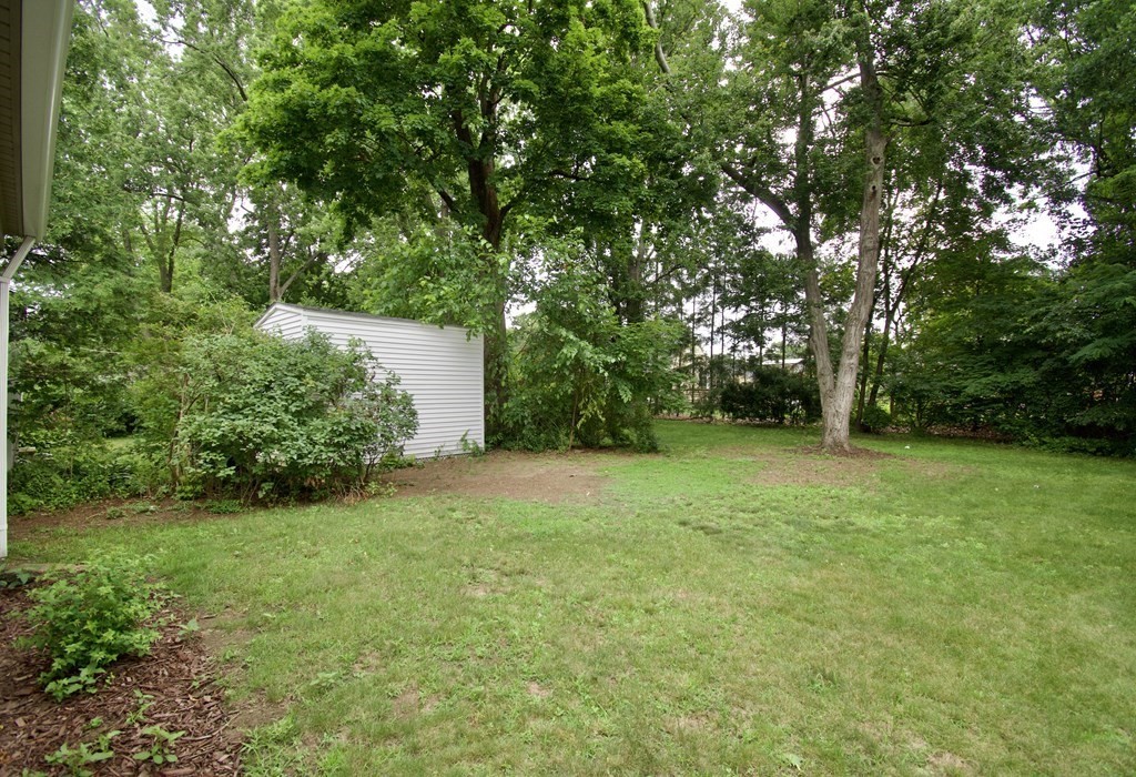 153 Gillette Avenue Springfield, MA 01118 - Photo 28 of 32 a backyard of a house with lots of green space