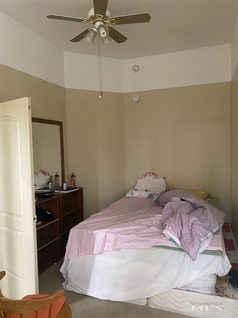 53 West 9th Street Reno, NV 89503 - Photo 12 of 33 a bedroom with a bed and a table