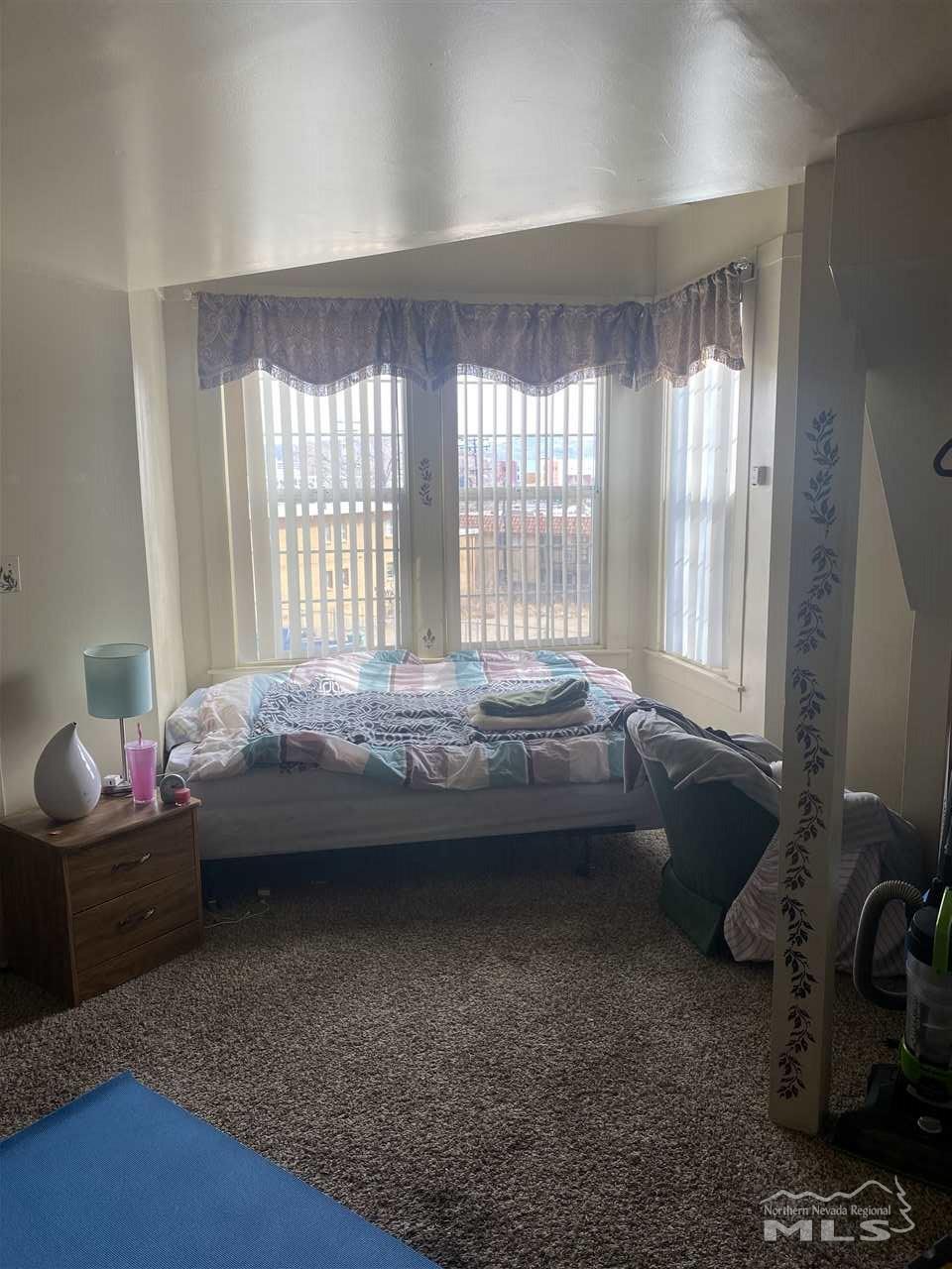 53 West 9th Street Reno, NV 89503 - Photo 15 of 33 a bedroom with a bed and a window
