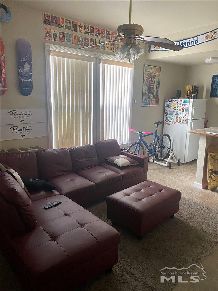 53 West 9th Street Reno, NV 89503 - Photo 18 of 33 a living room with furniture and a chandelier