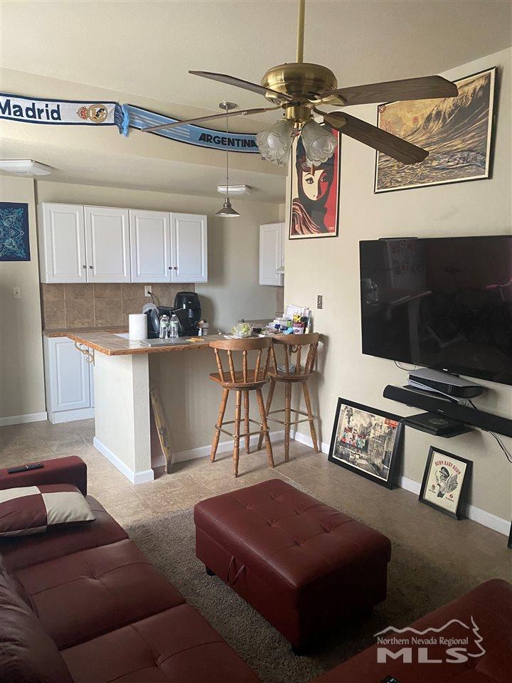 53 West 9th Street Reno, NV 89503 - Photo 19 of 33 a living room with furniture and a flat screen tv