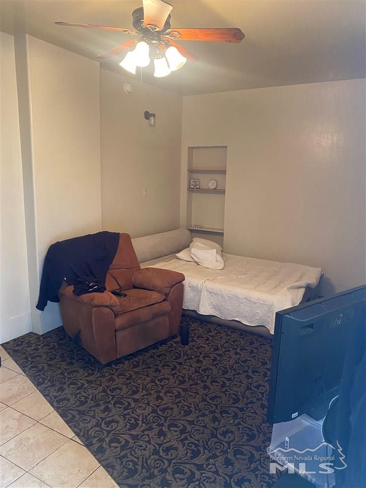 53 West 9th Street Reno, NV 89503 - Photo 23 of 33 a living room with furniture and a chandelier