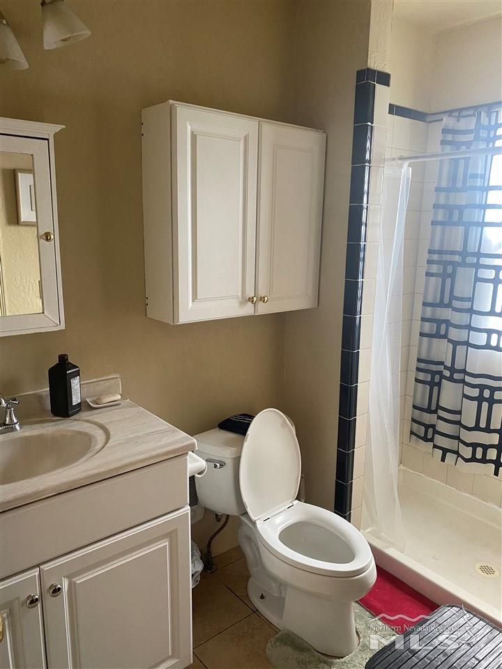 53 West 9th Street Reno, NV 89503 - Photo 26 of 33 a bathroom with a toilet and a sink