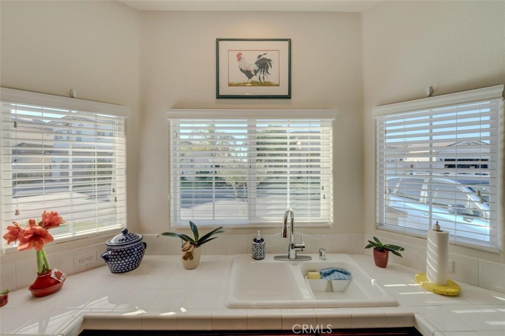 1526 South Fulton Court Santa Maria, CA 93458 - Photo 12 of 39 a bathroom with a tub sink and window