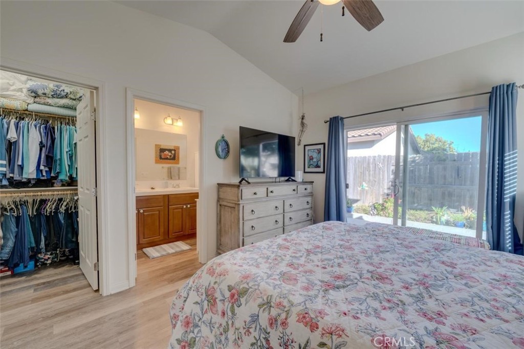 1526 South Fulton Court Santa Maria, CA 93458 - Photo 17 of 39 a large bedroom with a large bed and a flat tv screen on dresser