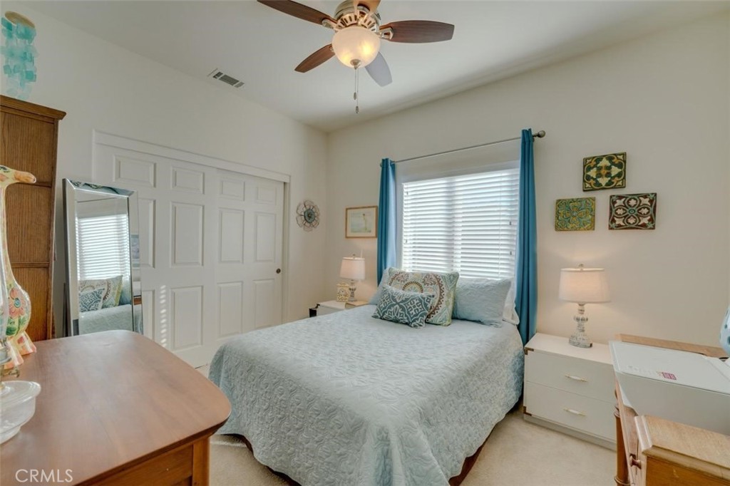 1526 South Fulton Court Santa Maria, CA 93458 - Photo 23 of 39 a bedroom with a bed and a chandelier