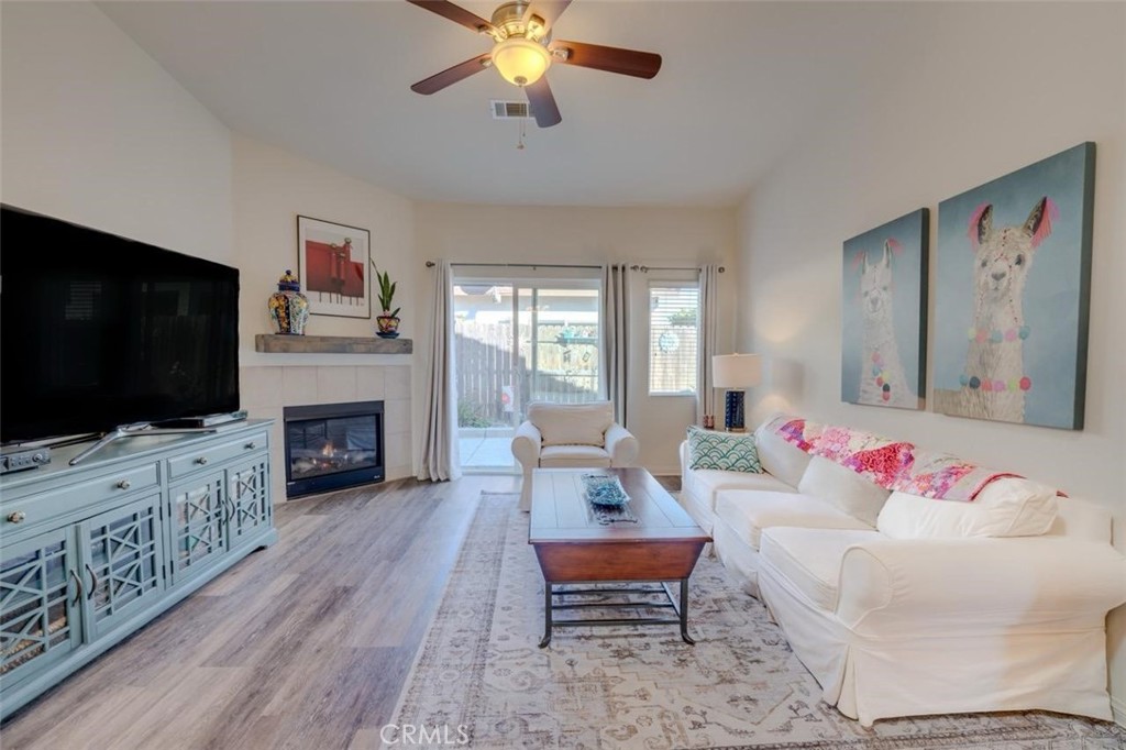1526 South Fulton Court Santa Maria, CA 93458 - Photo 3 of 39 a living room with furniture fireplace and flat screen tv