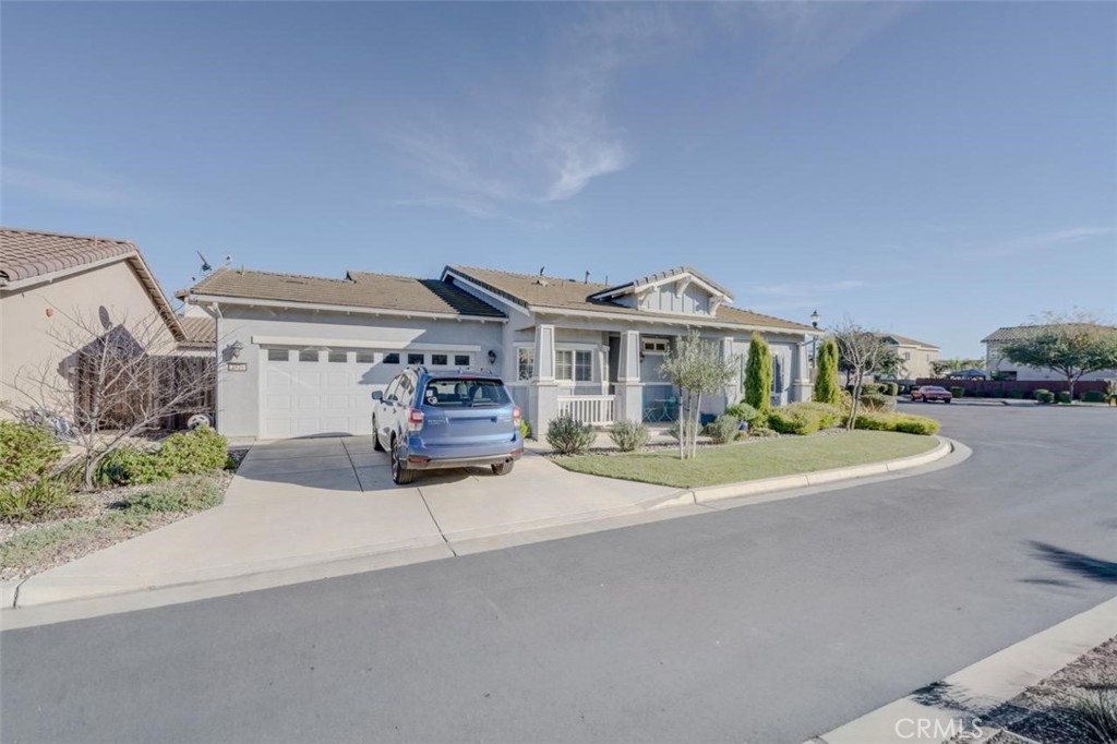 1526 South Fulton Court Santa Maria, CA 93458 - Photo 35 of 39 a front view of a house with a garden and parking