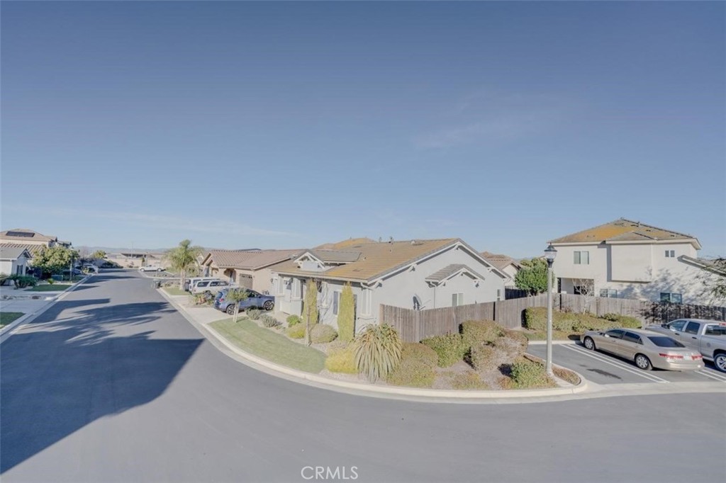 1526 South Fulton Court Santa Maria, CA 93458 - Photo 37 of 39 a view of a house with a bathtub and potted plants in the background