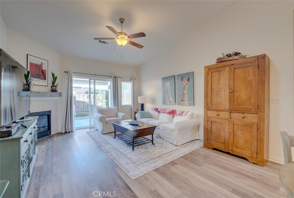 1526 South Fulton Court Santa Maria, CA 93458 - Photo 4 of 39 a living room with furniture and a flat screen tv