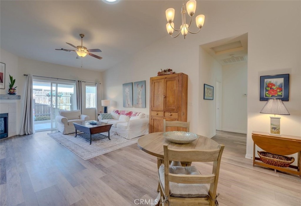 1526 South Fulton Court Santa Maria, CA 93458 - Photo 5 of 39 a living room with furniture a window and a chandelier