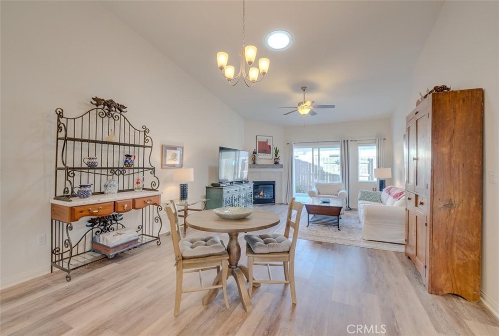 1526 South Fulton Court Santa Maria, CA 93458 - Photo 6 of 39 a living room with furniture a dining table and a piano table