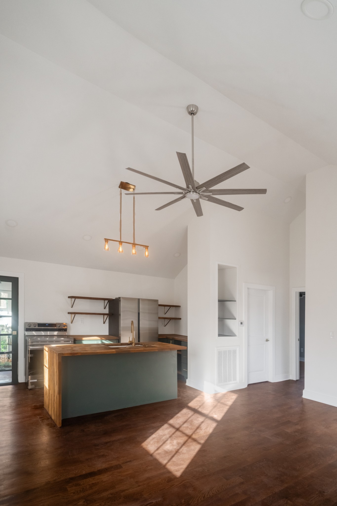 337 Harris Street Madison, TN 37115 - Photo 5 of 18 a kitchen with kitchen island a counter top space appliances and a ceiling fan