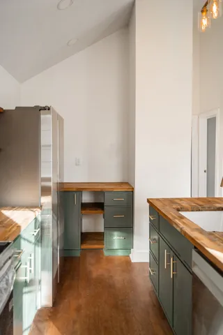 a kitchen with a sink and a stove