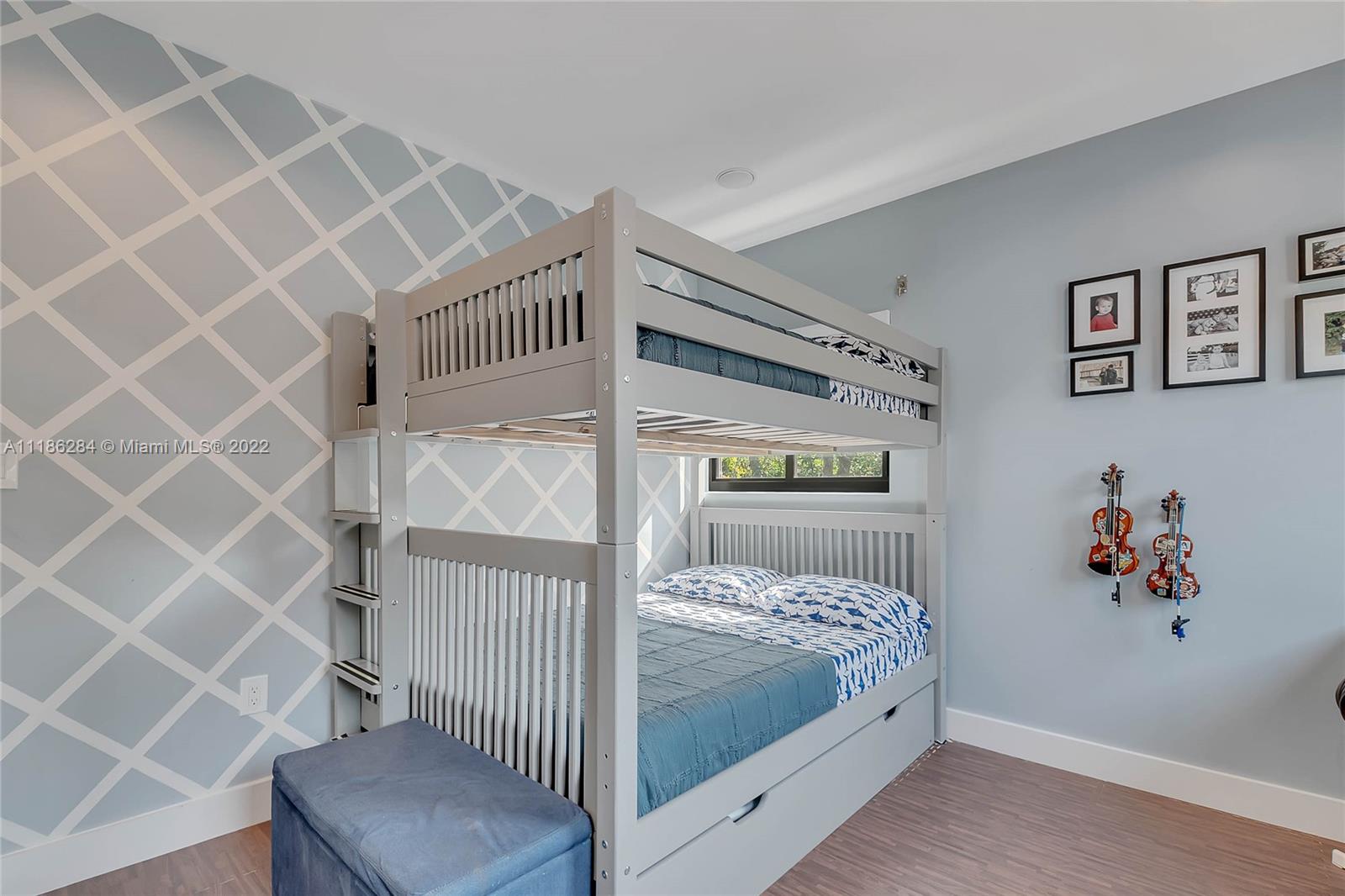 3263 Allamanda Street, Unit 3263 Miami, FL 33133 - Photo 12 of 28 a bedroom with a bed and a window