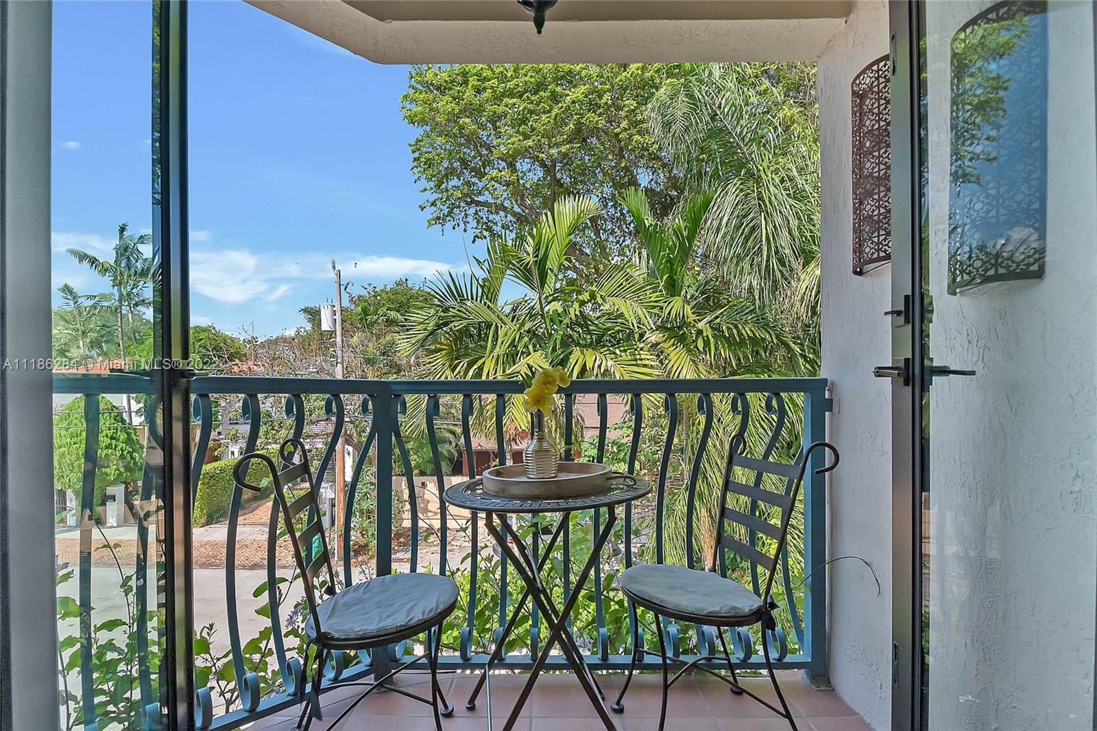 3263 Allamanda Street, Unit 3263 Miami, FL 33133 - Photo 19 of 28 a view of a chairs and table in the balcony