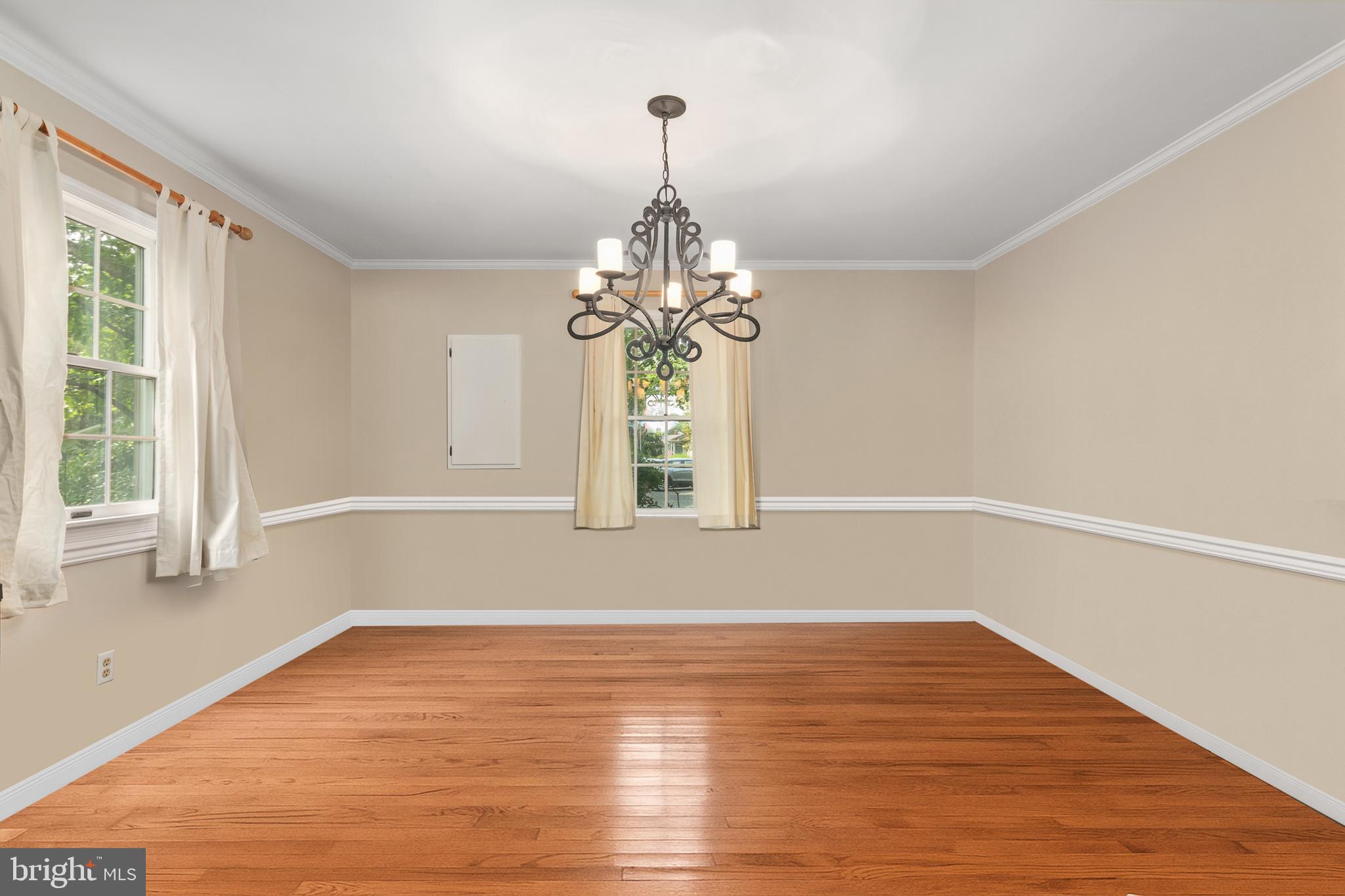 101 Sinclair Street Oxford, MD 21654 - Photo 14 of 31 a view of wooden floor chandelier and window in a room