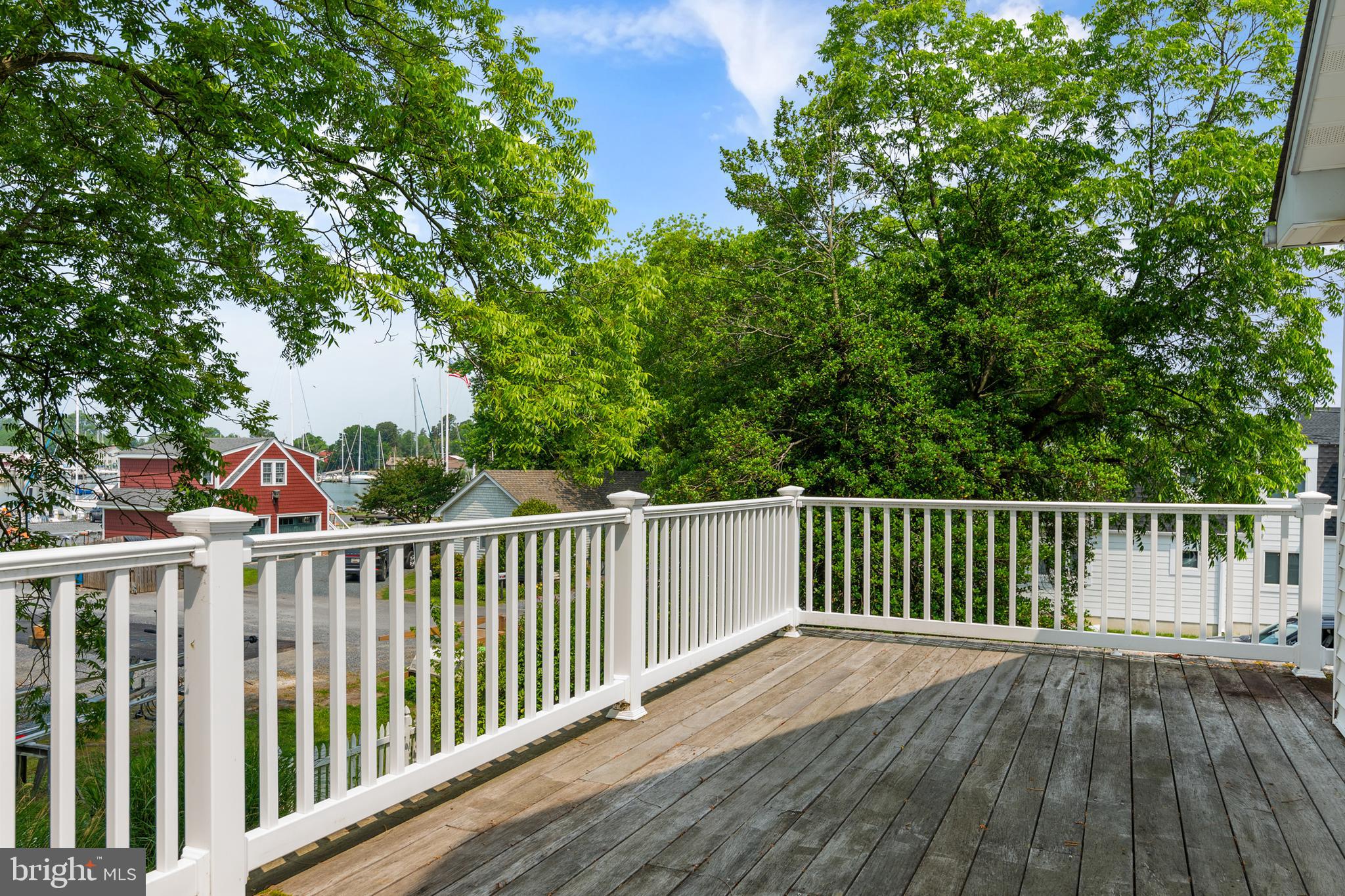 101 Sinclair Street Oxford, MD 21654 - Photo 18 of 31 a view of balcony with wooden floor and fence