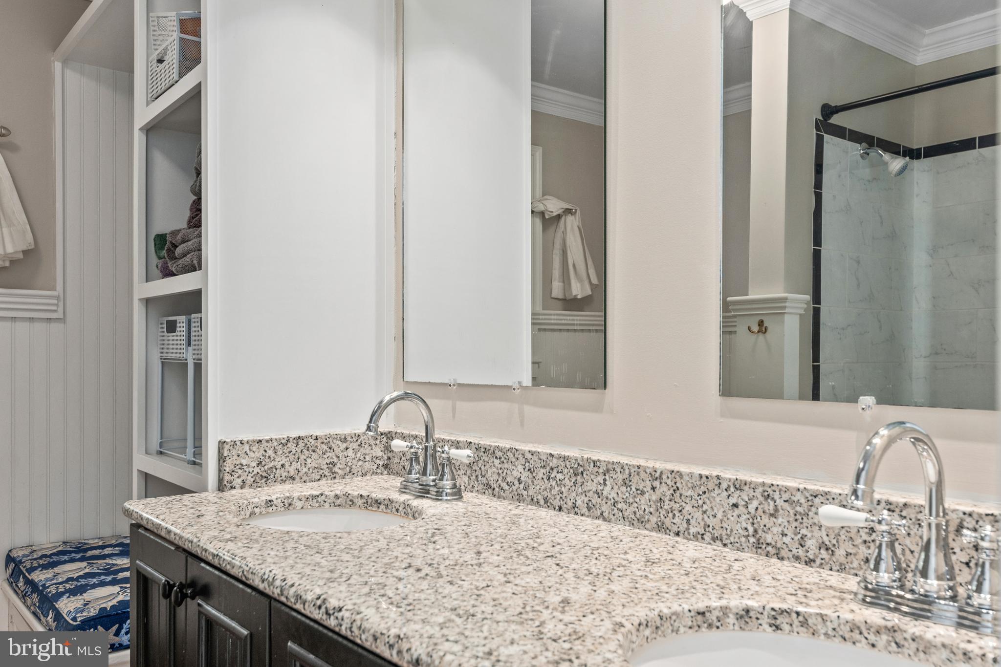 101 Sinclair Street Oxford, MD 21654 - Photo 20 of 31 a bathroom with a granite countertop sink and a mirror